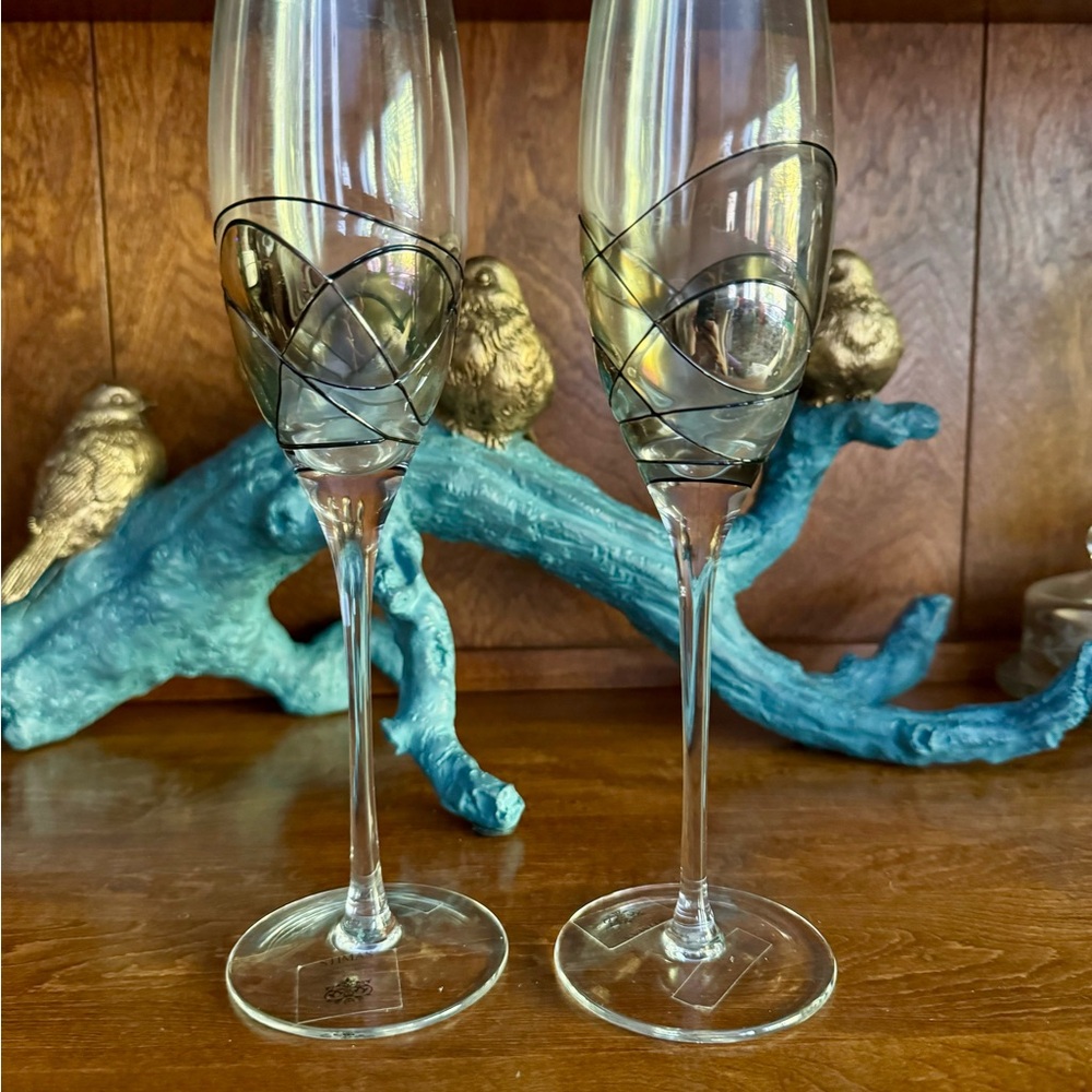 Intricate hand painted glass champagne flutes
